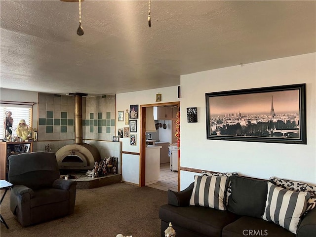 carpeted living room featuring a textured ceiling and tile walls