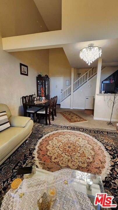 interior space with an inviting chandelier and vaulted ceiling