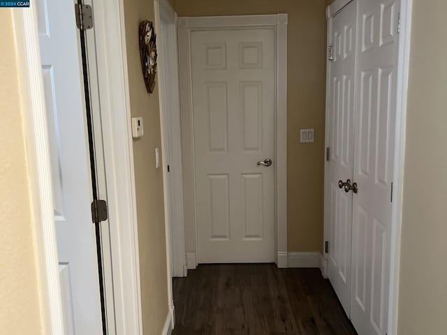 corridor with dark wood-type flooring