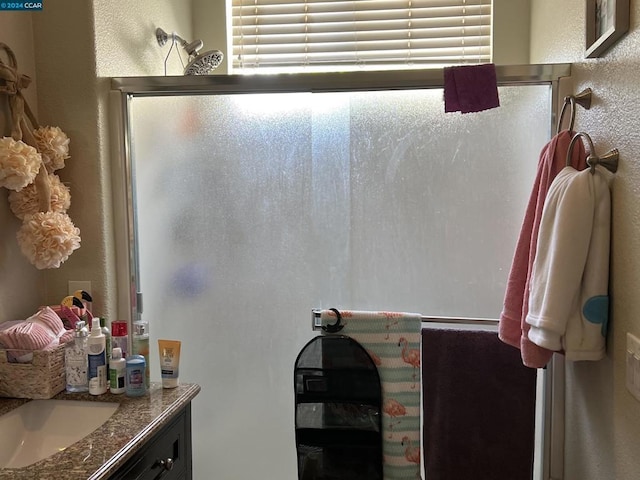 bathroom with vanity and an enclosed shower