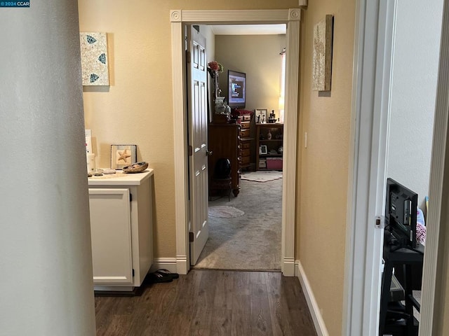 corridor with dark wood-type flooring