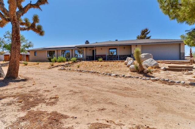 ranch-style home with a garage