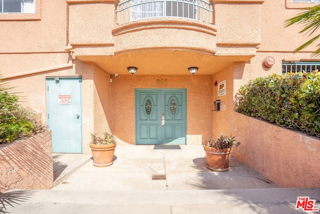 doorway to property featuring a balcony