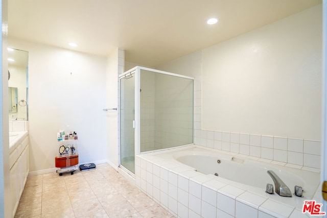 bathroom with separate shower and tub, tile patterned flooring, and vanity