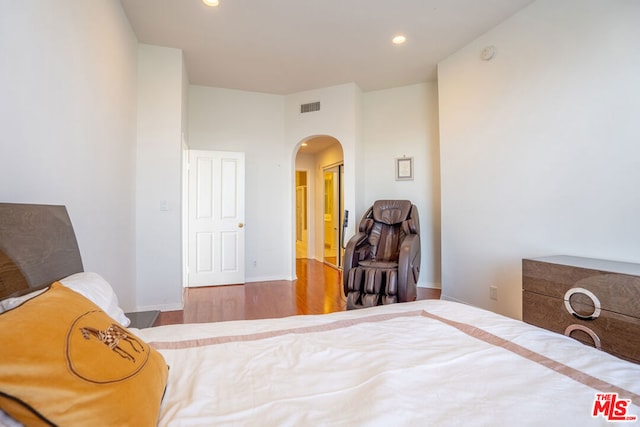 bedroom with wood-type flooring