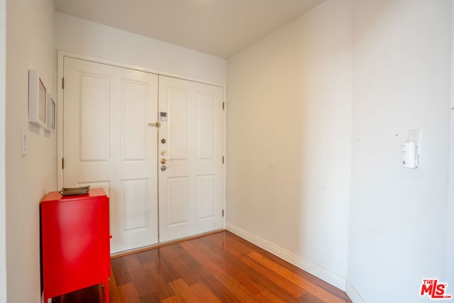 entrance foyer with dark hardwood / wood-style floors