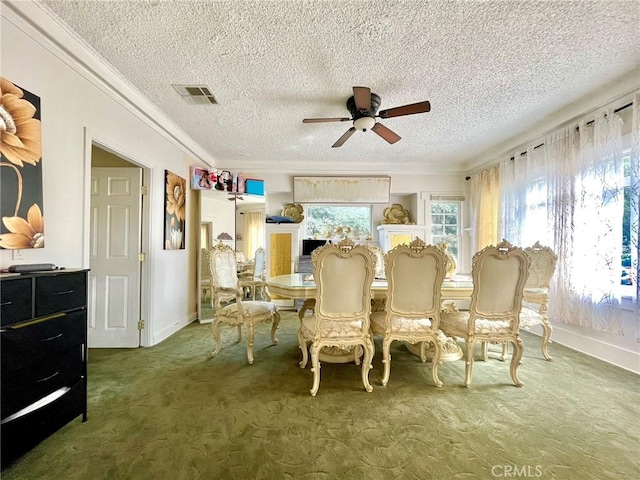 dining area with carpet, ceiling fan, ornamental molding, and a textured ceiling