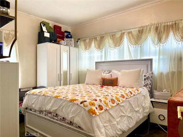 bedroom with ornamental molding