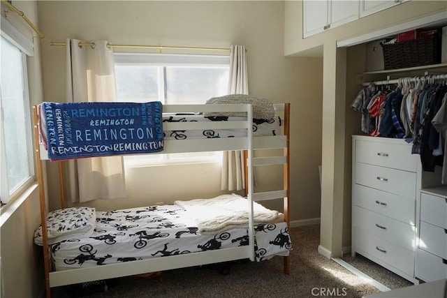 carpeted bedroom with a closet