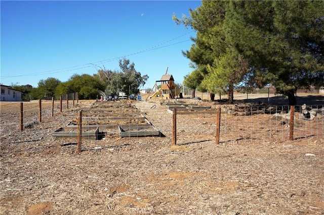 view of yard featuring a playground and a rural view