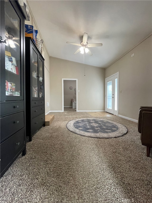 interior space featuring ceiling fan, french doors, and carpet