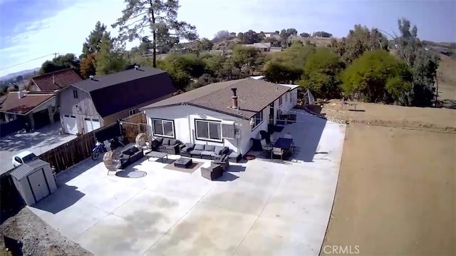 rear view of house featuring an outdoor living space