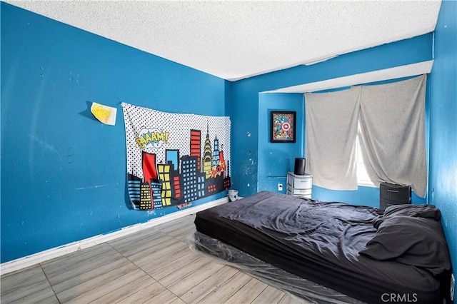 bedroom featuring a textured ceiling