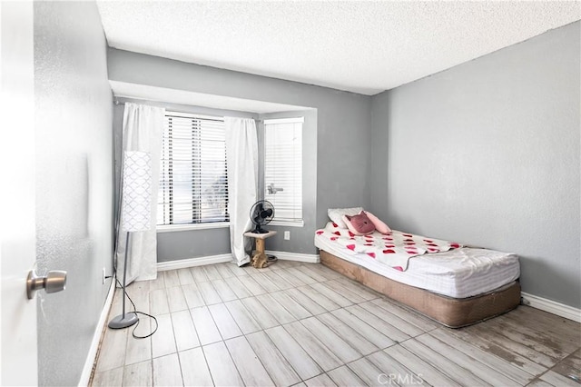 bedroom featuring a textured ceiling