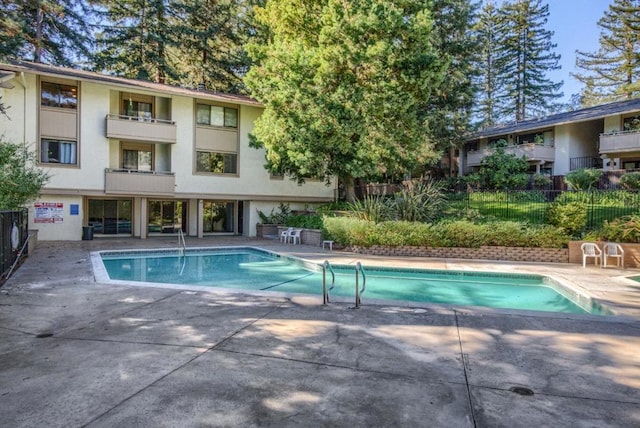 view of pool featuring a patio area