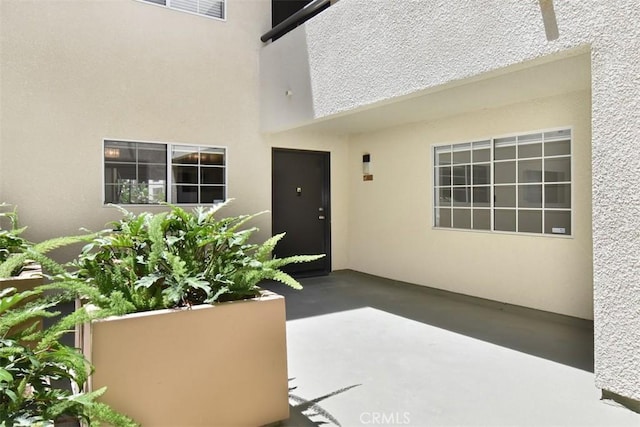 doorway to property featuring a patio