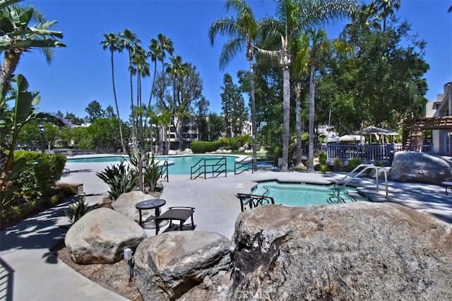 view of swimming pool with a patio area