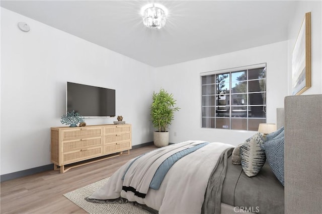 bedroom with hardwood / wood-style floors