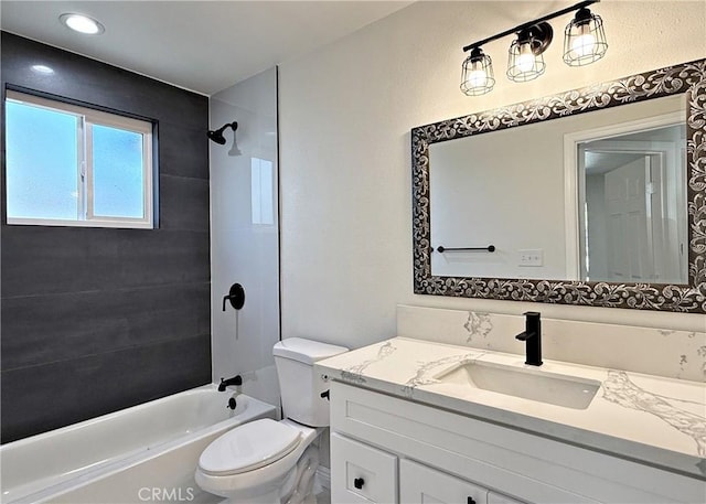 full bathroom with toilet, vanity, and tiled shower / bath combo