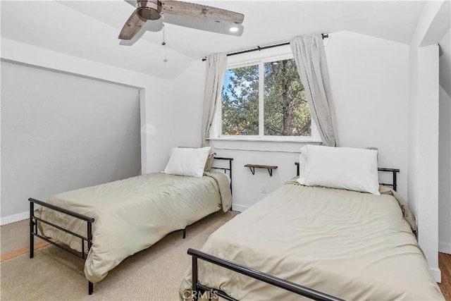 bedroom with ceiling fan and vaulted ceiling