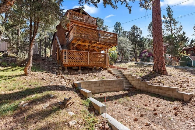 view of yard featuring a wooden deck