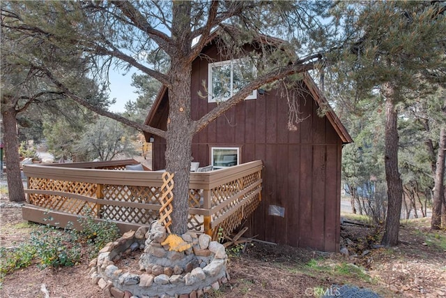 view of property exterior with a deck