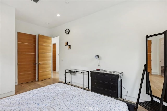 bedroom featuring light hardwood / wood-style floors