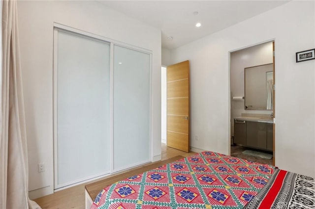 bedroom featuring ensuite bath