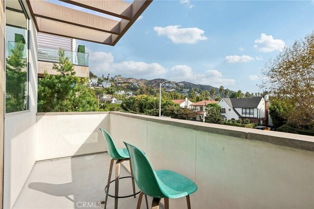 balcony featuring a mountain view