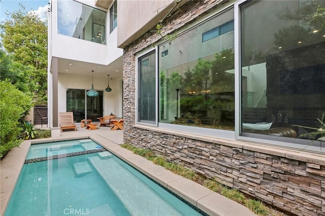 rear view of house featuring a patio