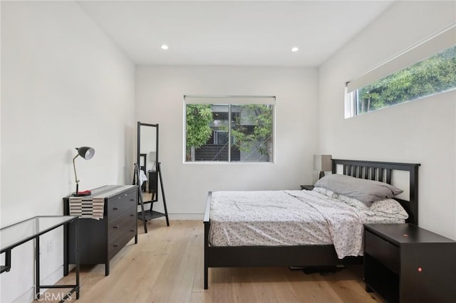 bedroom with light hardwood / wood-style flooring