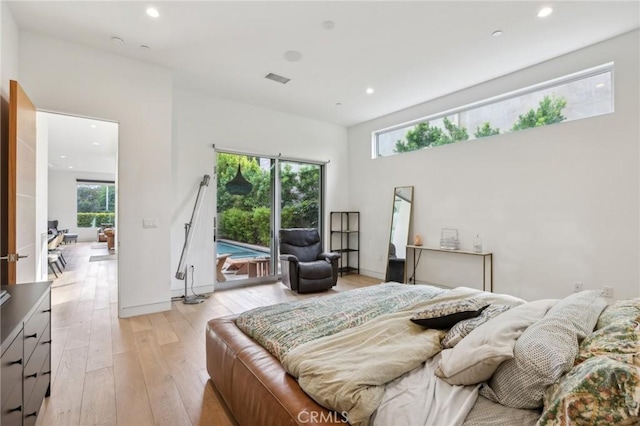 bedroom featuring light hardwood / wood-style flooring and access to outside