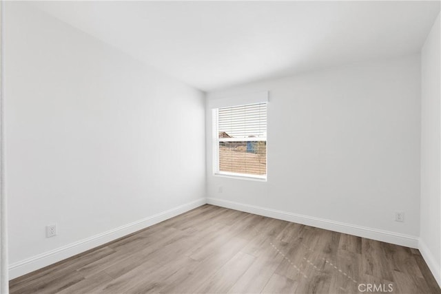 spare room with light wood-type flooring