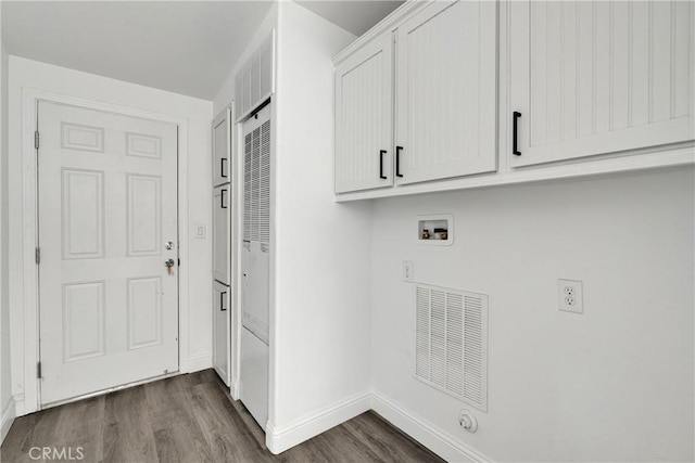 laundry room with cabinets, hookup for a washing machine, and dark wood-type flooring