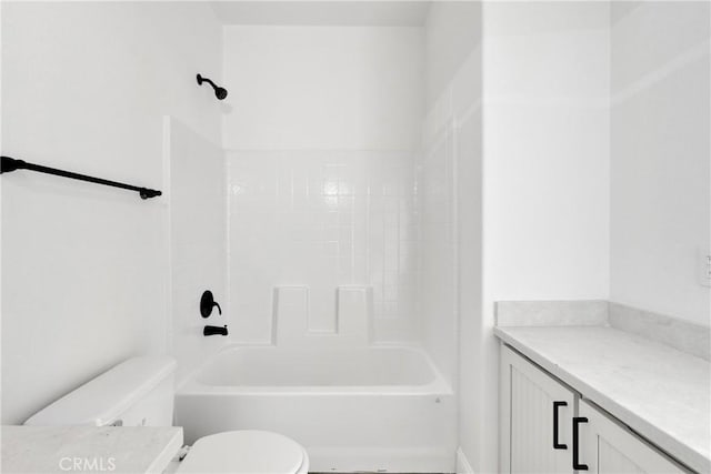 bathroom with bathtub / shower combination and toilet