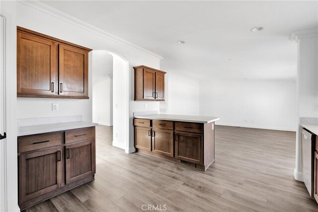 kitchen featuring light hardwood / wood-style floors and ornamental molding