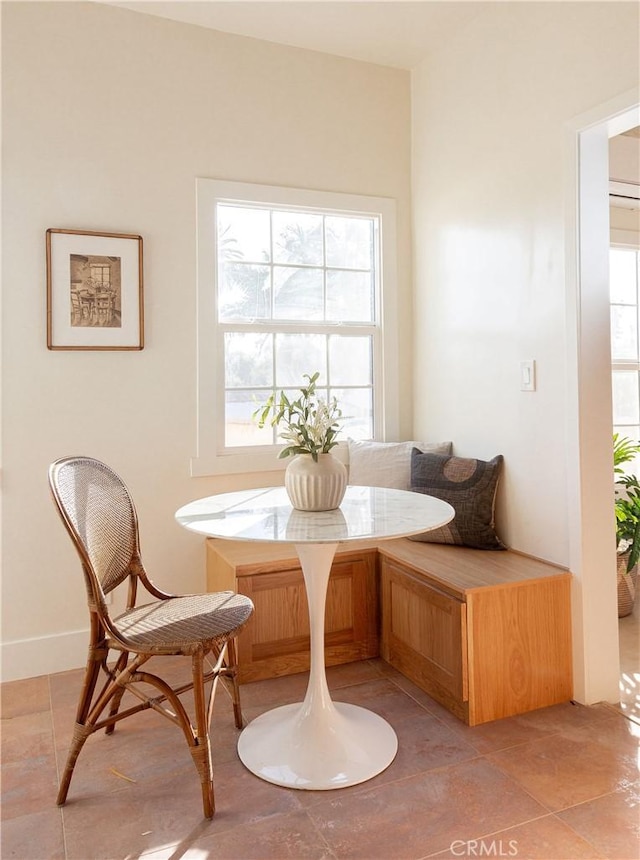 sitting room featuring tile patterned floors and breakfast area