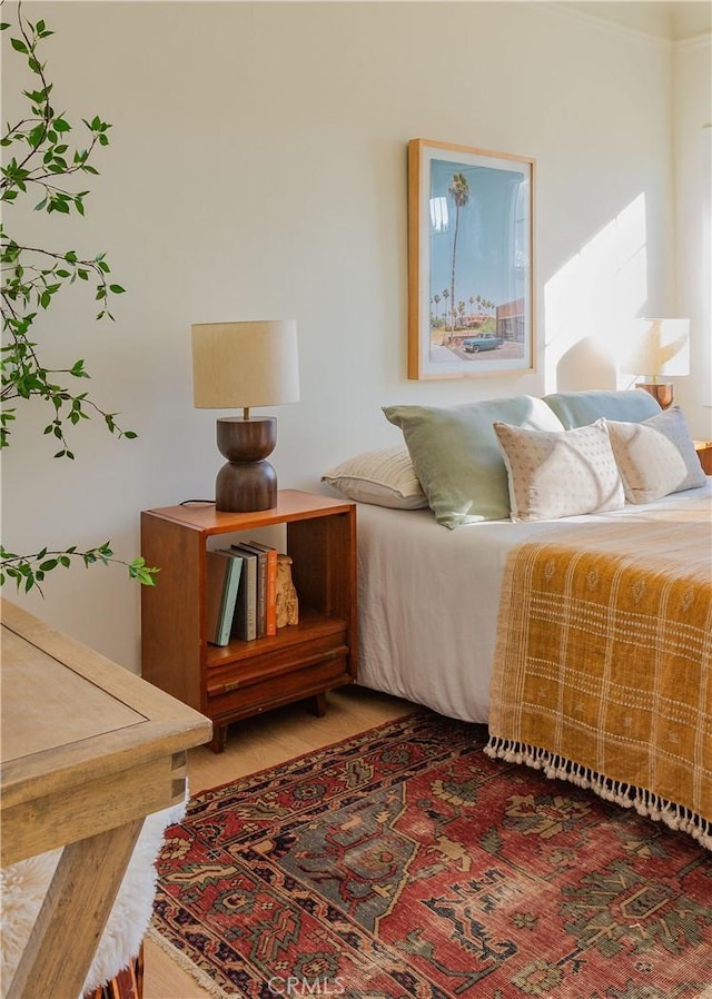 bedroom with hardwood / wood-style flooring