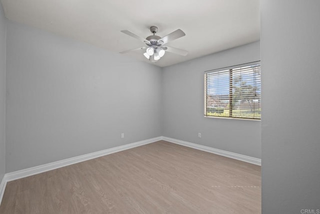 empty room with light hardwood / wood-style flooring and ceiling fan