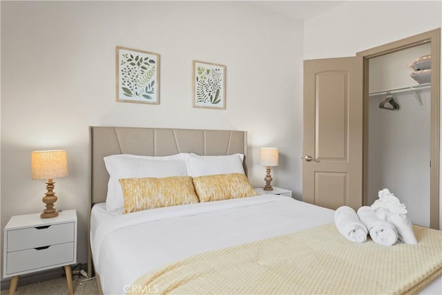 carpeted bedroom featuring a closet