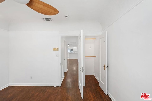 hallway with dark wood-type flooring