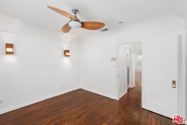 unfurnished room with ceiling fan and dark wood-type flooring