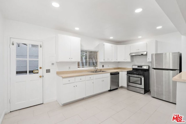 kitchen featuring white cabinets, sink, and stainless steel appliances