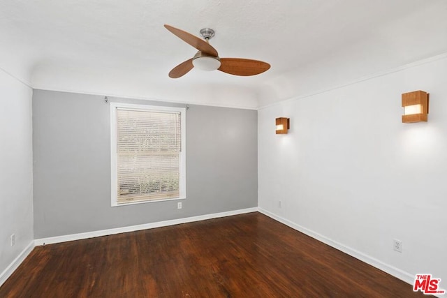 empty room with hardwood / wood-style flooring and ceiling fan