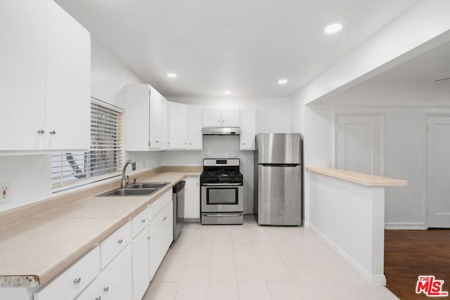 kitchen with white cabinetry, sink, and appliances with stainless steel finishes