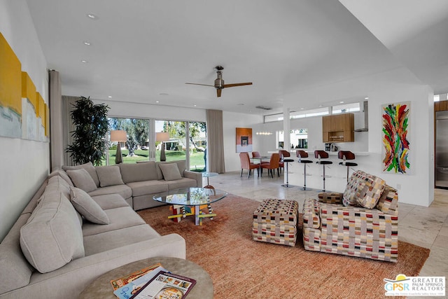 tiled living room with ceiling fan