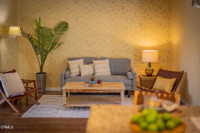 sitting room with hardwood / wood-style flooring