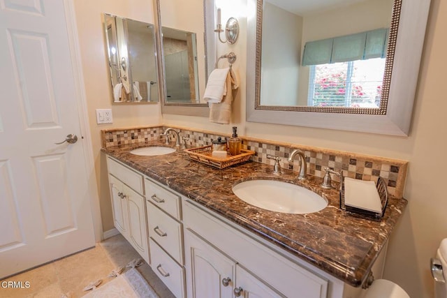 bathroom featuring vanity, backsplash, and tile patterned floors