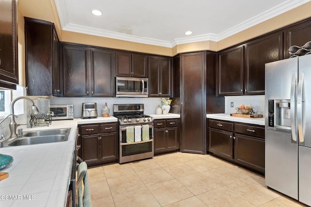 kitchen with ornamental molding, stainless steel appliances, sink, and dark brown cabinetry