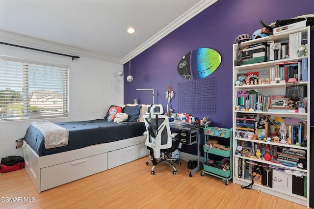 bedroom with wood-type flooring and ornamental molding